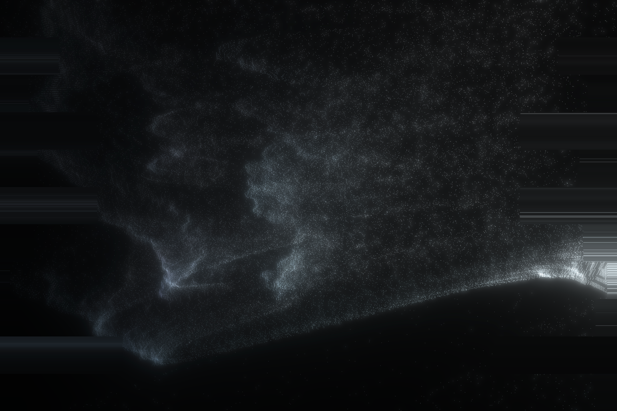 A cloud of pale gray particles forming a shape against a black background